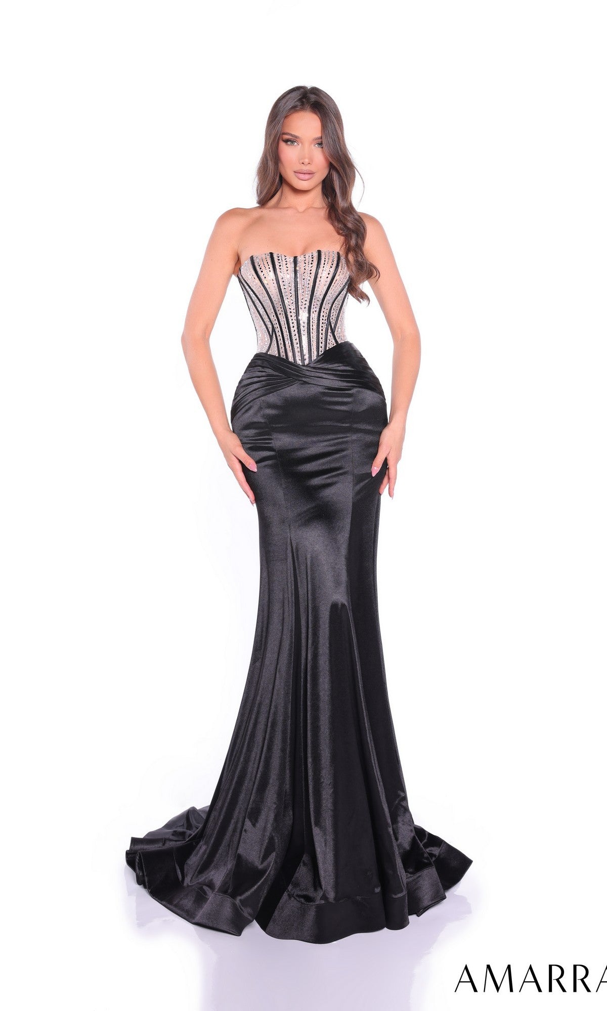 A woman faces forward in a strapless black satin mermaid dress with beaded corset bodice (Amarra 89070), set against a white background.